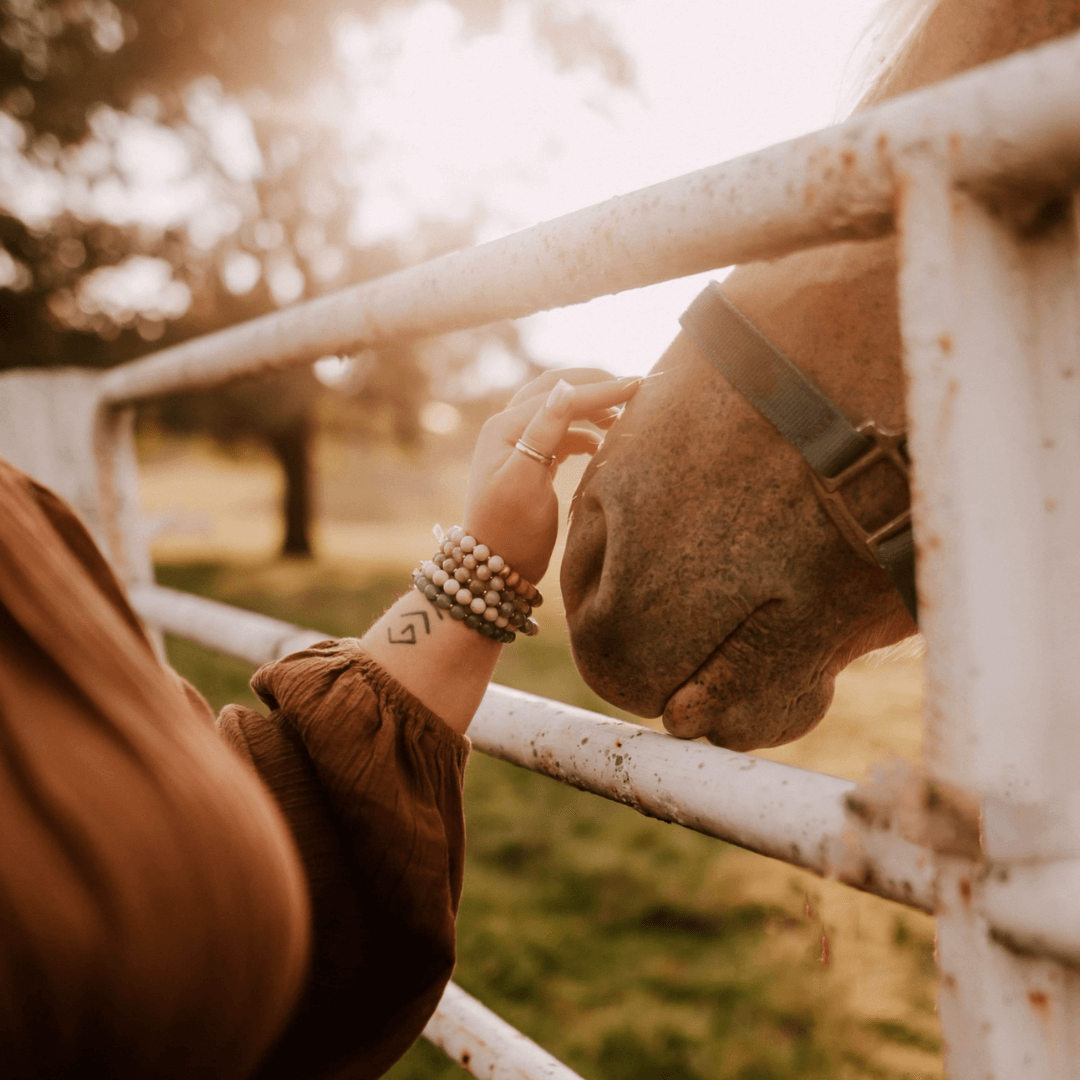 woman with horse and bracelets