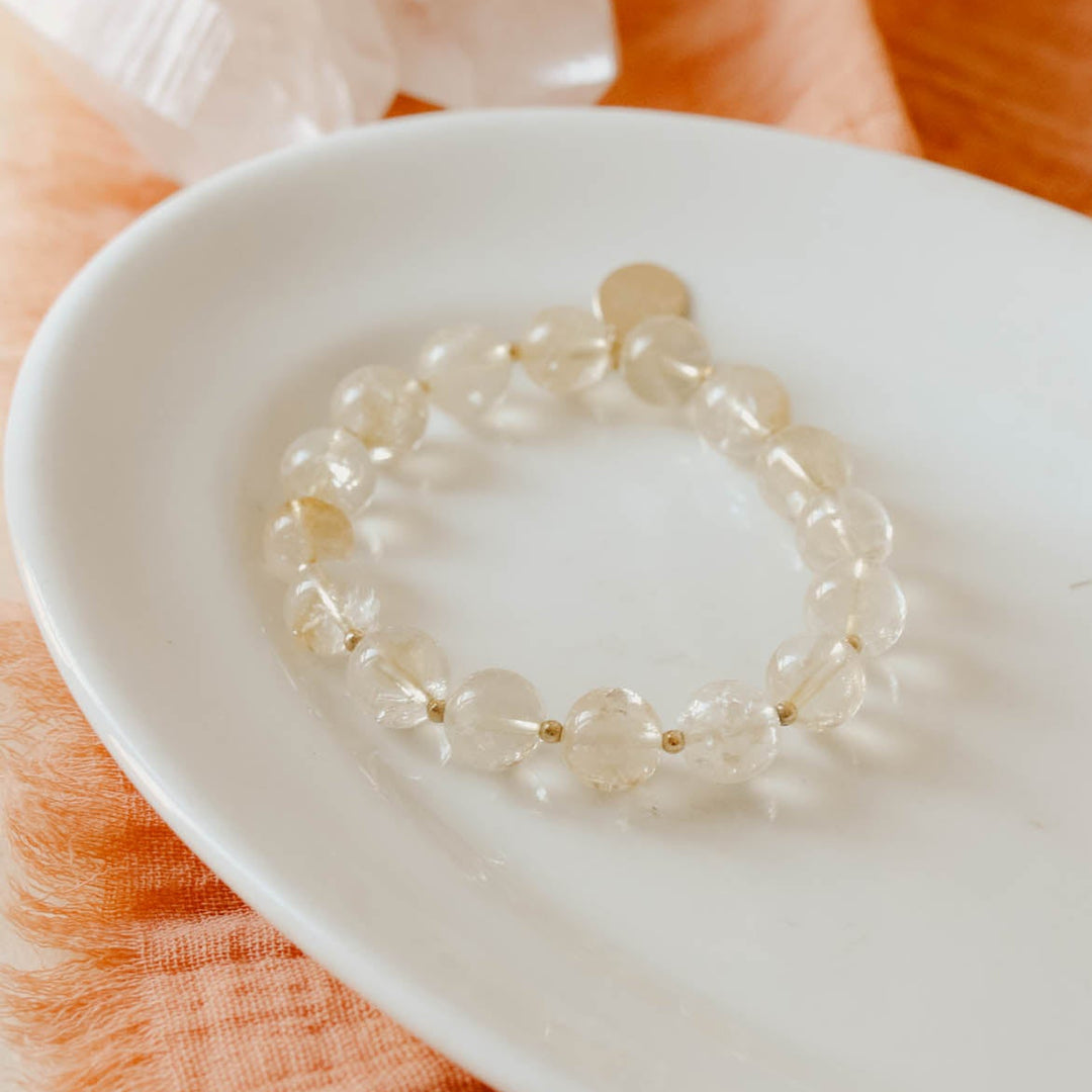 Cirtine on a white dish with an orange fabric background